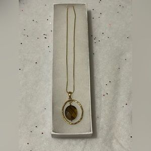 Gold tone tiger eye necklace.